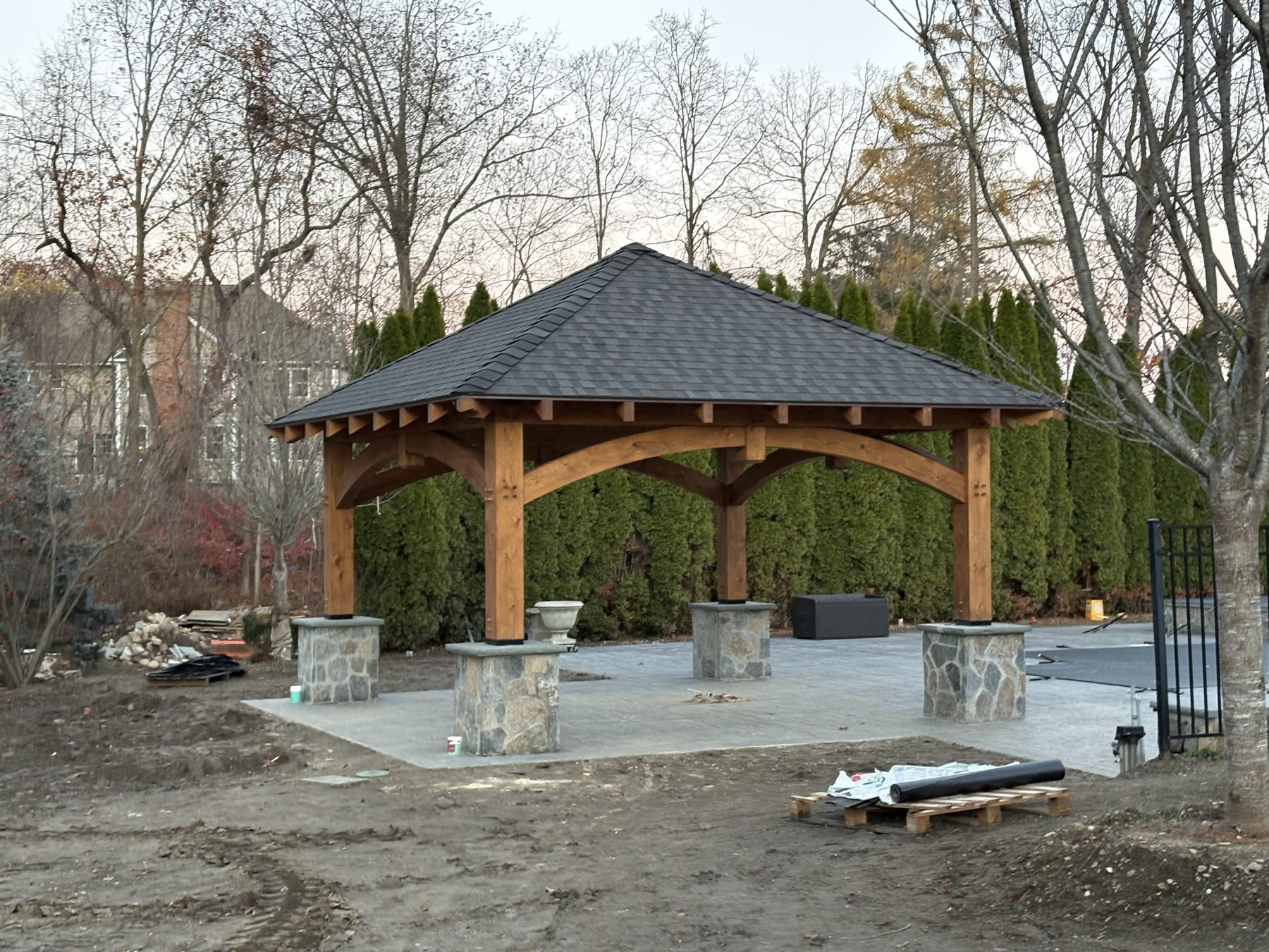 Finished timber frame pavilion standing on stone piers